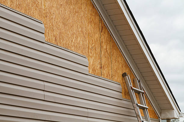 Professional Siding technician working in Cortland, NY